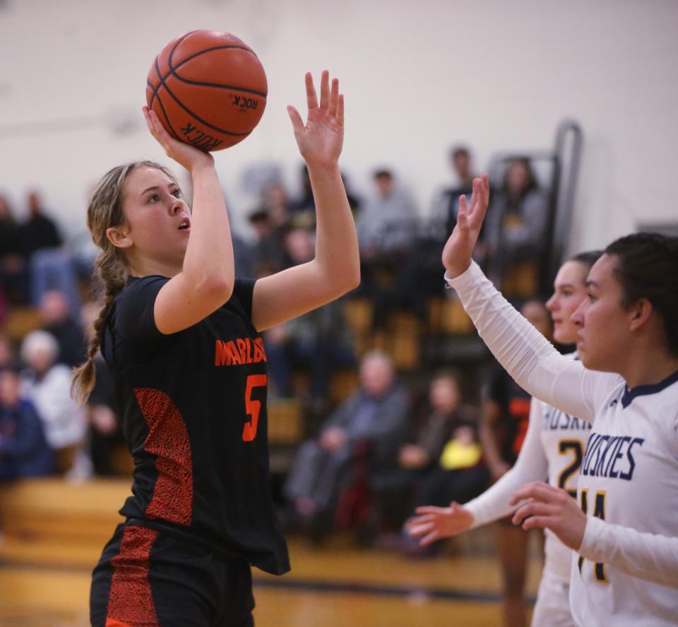 Marlboro's Hannah Polumbo takes a jump shot as Highland's Ciara Teamer covers her during Friday's game on December 8, 2023.