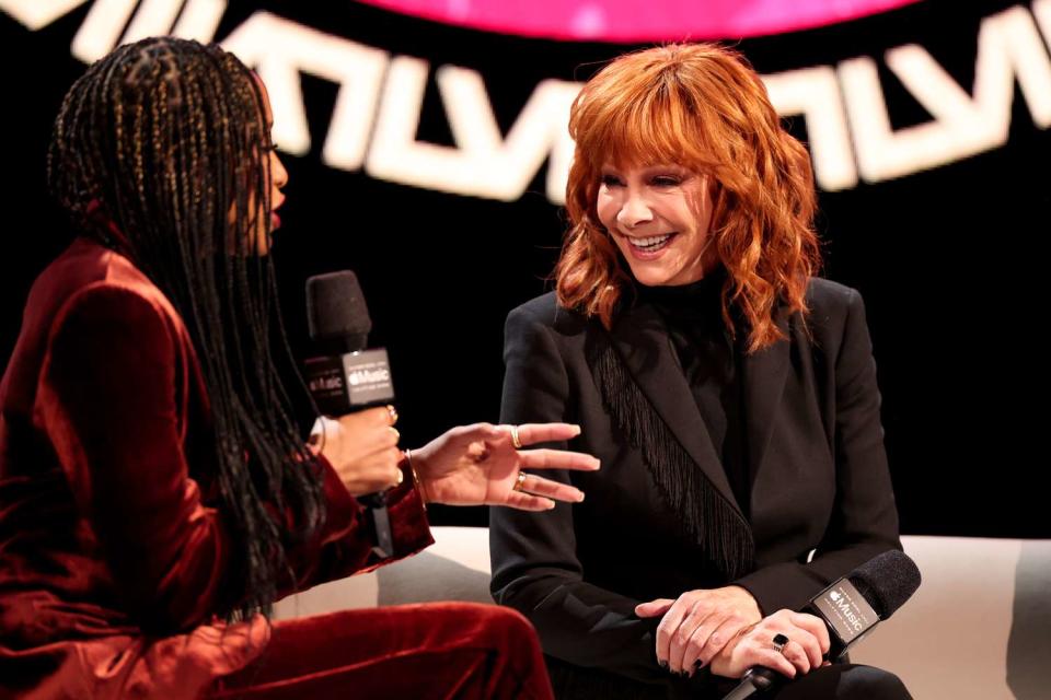 <p>Christopher Polk/Variety via Getty</p> Nadeska Alexis and Reba McEntire at the Super Bowl LVIII Pregame + Apple Music Super Bowl LVIII Halftime Show press conference held at Mandalay Bay Convention Center on Feb. 8, 2024 in Las Vegas