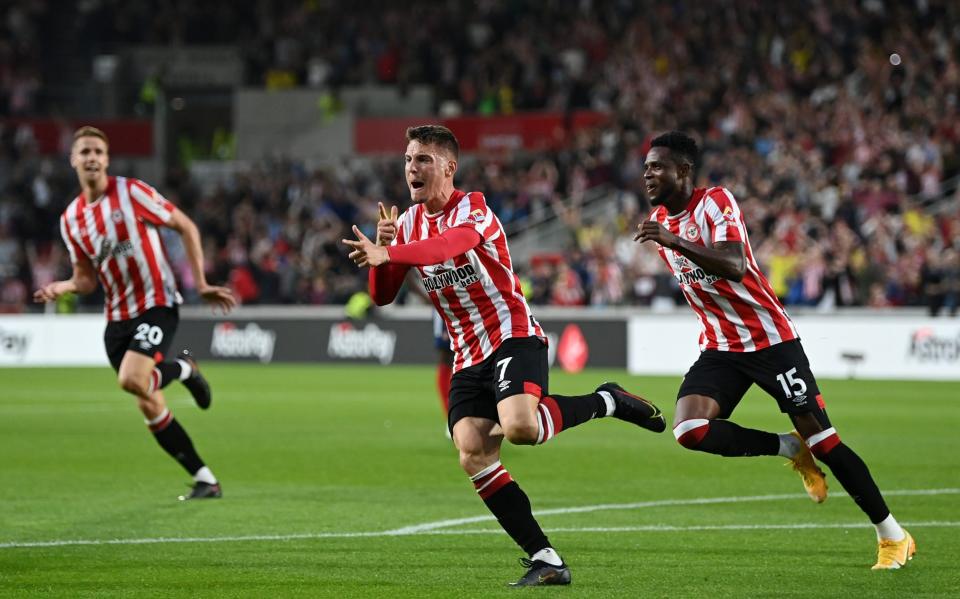 Sergi Canos of Brentford celebrates after scoring their team's first goal during the Premier League match between Brentford and Arsenal - GETTY IMAGES