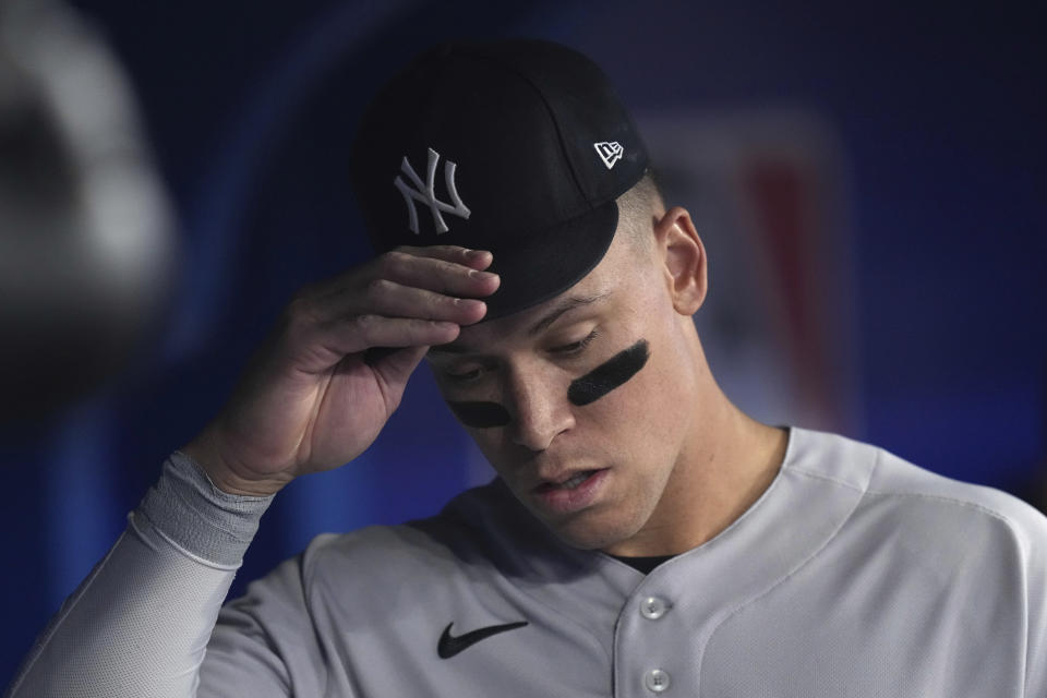New York Yankees' Aaron Judge (99) stands in the dugout before the team's baseball game against the Toronto Blue Jays on Tuesday, May 16, 2023, in Toronto. (Chris Young/The Canadian Press via AP)