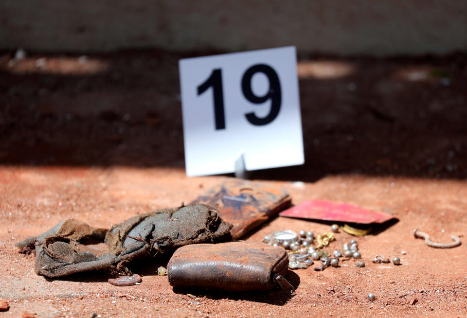 An investigation marker is seen near belongings at St. Sebastian Catholic Church, after bomb blasts ripped through churches and luxury hotels on Easter, in Negombo, Sri Lanka April 22, 2019. Photo: Athit Perawongmetha/Reuters)