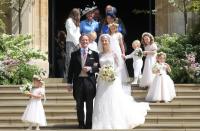 <p>The bride and groom smile on the steps of St. George's Chapel after the ceremony. </p>