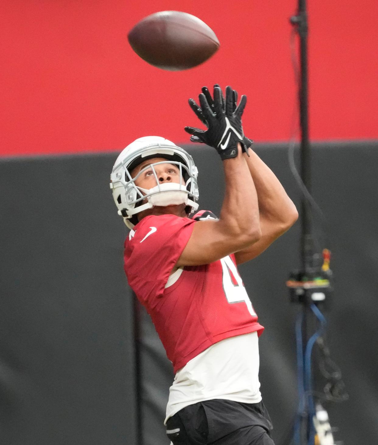 Aug 8, 2022; Glendale, Arizona, U.S.;  Arizona Cardinals wide receiver Rondale Moore (4) catches a pass during training camp at State Farm Stadium.