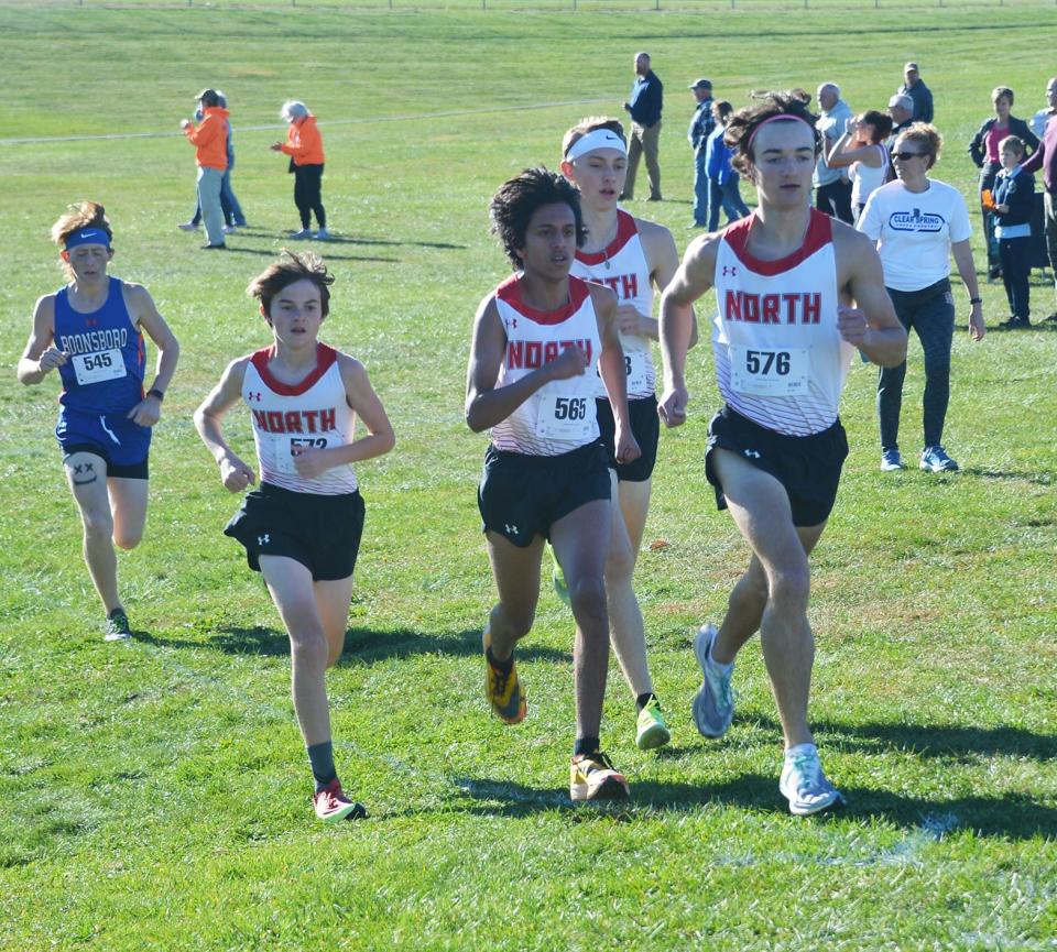 North Hagerstown senior Jacob O'Neil (576), sophomore Rishi Bhat (565), freshman Walker Mason (second from left) and junior Sullivan McGreevy (back center) run at the front in the first half-mile of the boys race in the 2022 Washington County Public Schools Cross Country Championships at Clear Spring on Oct. 27. O'Neil won the race in 17:19.1, Bhat finished second in 17:24.7, Mason placed third in 17:35.5 and McGreevy took fifth in 18:31.4.