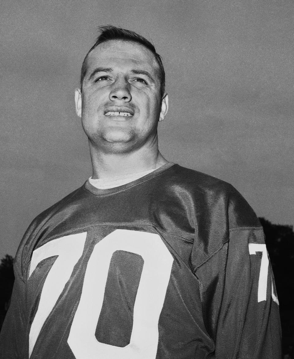 New York Giants linebacker Sam Huff poses for a photo at the NFL football team's training camp in Fairfield, Conn., in September 1963. Huff, the hard-hitting Hall of Fame linebacker who helped the Giants reach six NFL title games from the mid-1950s to the early 1960s and later became a popular player and announcer in Washington, died Saturday, Nov. 13, 2021. He was 87.