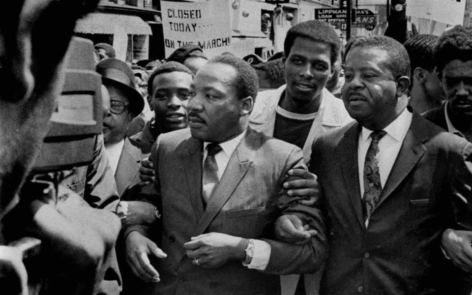 Martin Luther King Jr (c) described Jewish landlords in Chicago as showing greater favour towards white tenants - AP/Sam Melhorn