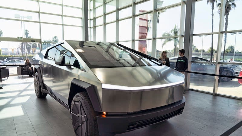 A Tesla Cybertruck is on display at the Tesla showroom in Buena Park, Calif., on Sunday, Dec. 3, 2023. Tesla is recalling 3,878 of its 2024 Cybertrucks after it discovered that the accelerator pedal can become stuck, potentially causing the vehicle to accelerate unintentionally and increasing the risk of a crash.