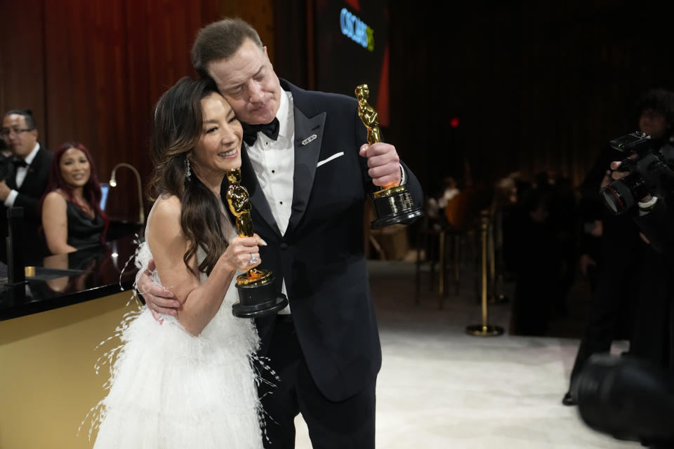 Michelle Yeoh, left, and Brendan Fraser pose with their awards at the Governors Ball after the Oscars on Sunday, March 12, 2023, at the Dolby Theatre in Los Angeles. Michelle Yeoh won the award for best performance by an actress in a leading role for "Everything Everywhere All at Once," and Brendan Fraser won the award for best performance by an actor in a leading role for "The Whale." (AP Photo/John Locher)