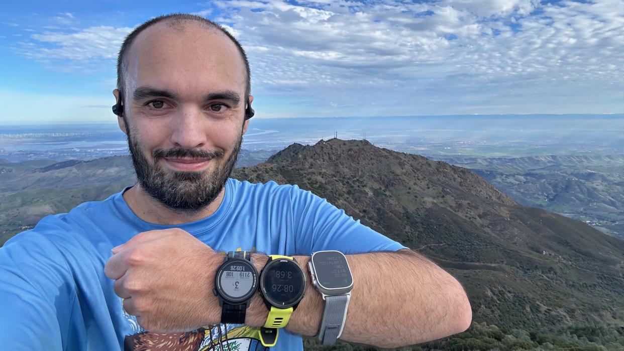  The author wearing an Apple Watch Ultra 2, COROS PACE 3, and Garmin Forerunner 965 at the Mount Diablo summit. . 