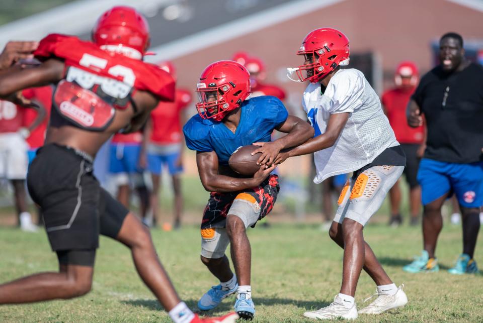 Miequle Brock (4) takes the handoff during football practice at Pine Forest High School in Pensacola on Wednesday, Aug. 16, 2023.