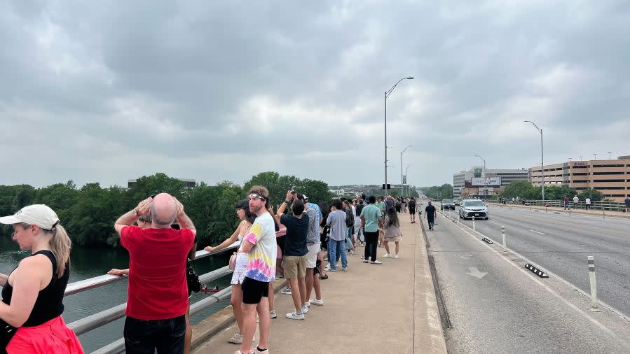 Folks watch the total solar eclipse from the Congress Avenue bridge in Austin, Texas, on April 8. (KXAN Photo/Andy Way)