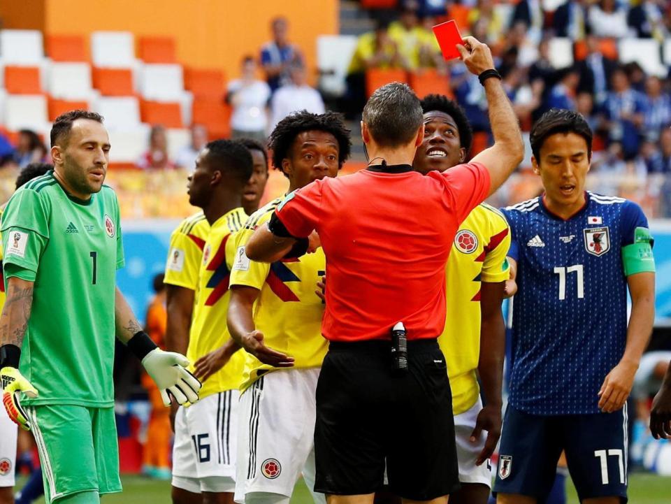 Referee Damir Skomina sends off Carlos Sanchez (Reuters)