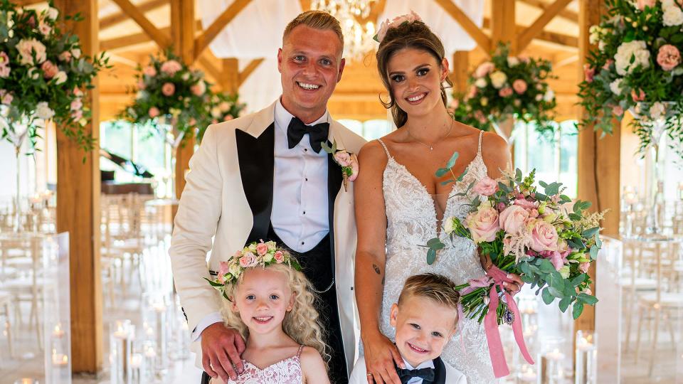 Kym Marsh's daughter is the perfect bride as she stands with new husband, page boy and flower girl