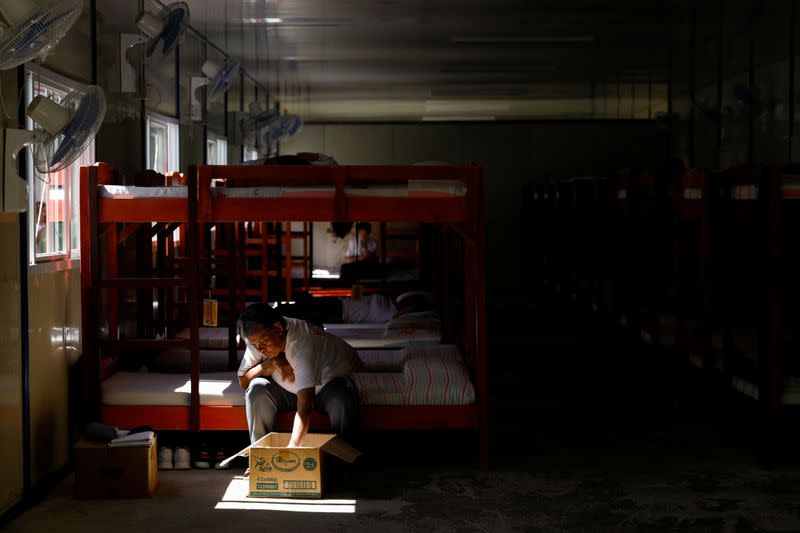 A drug rehab patient fixes her belongings at the female dormitory of the Mega Drug Abuse Treatment and Rehabilitation Center, in Nueva Ecija province