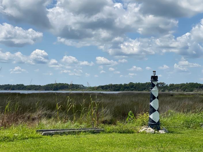 No need to travel all the way to Cape Lookout to see the lighthouse. Feeling like a local adventure? This replica can be discovered along one of the streets on Topsail Island. [John Althouse / The Daily News]