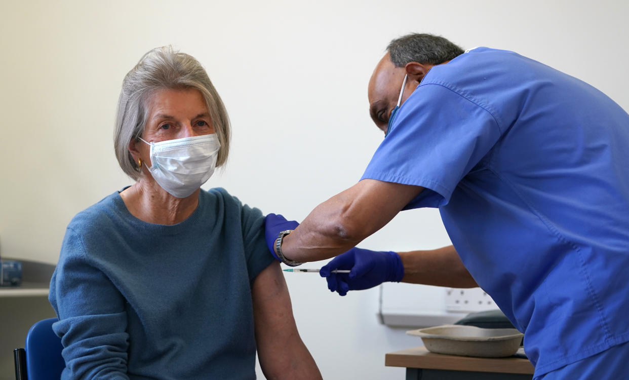 Doctor Abhi Mantgani administers a Covid-19 vaccine booster to Shirley Davies at Birkenhead Medical Building in Birkenhead, Merseyside. Picture date: Saturday October 23, 2021.