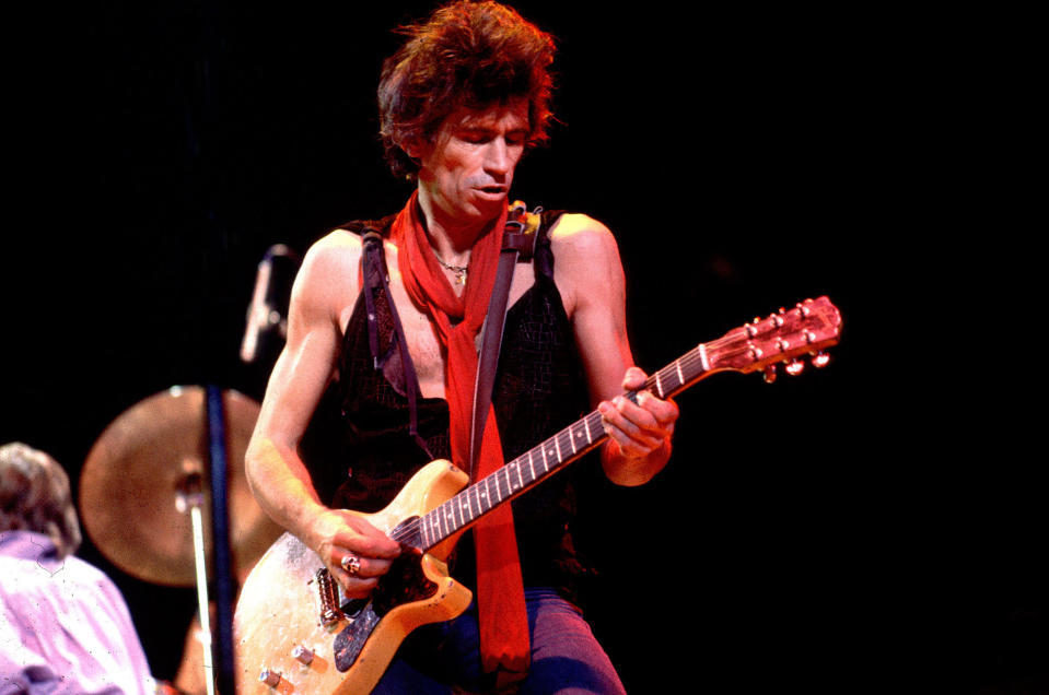 Keith Richards performs onstage with The Rolling Stones in 1981