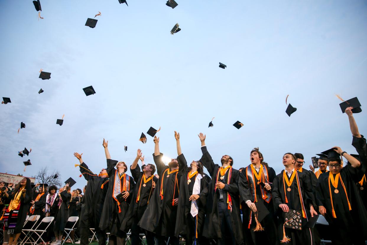 Sprague graduates throw their caps in the air at the end of the ceremony on Thursday, June 8, 2023 in Salem, Ore. 