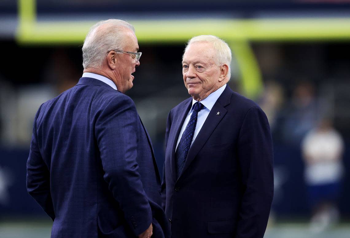 Dallas Cowboys owner Jerry Jones, right, and his son, Stephen Jones, talk on the sidelines before the start of game in 2021 at AT&T Stadium in Arlington.