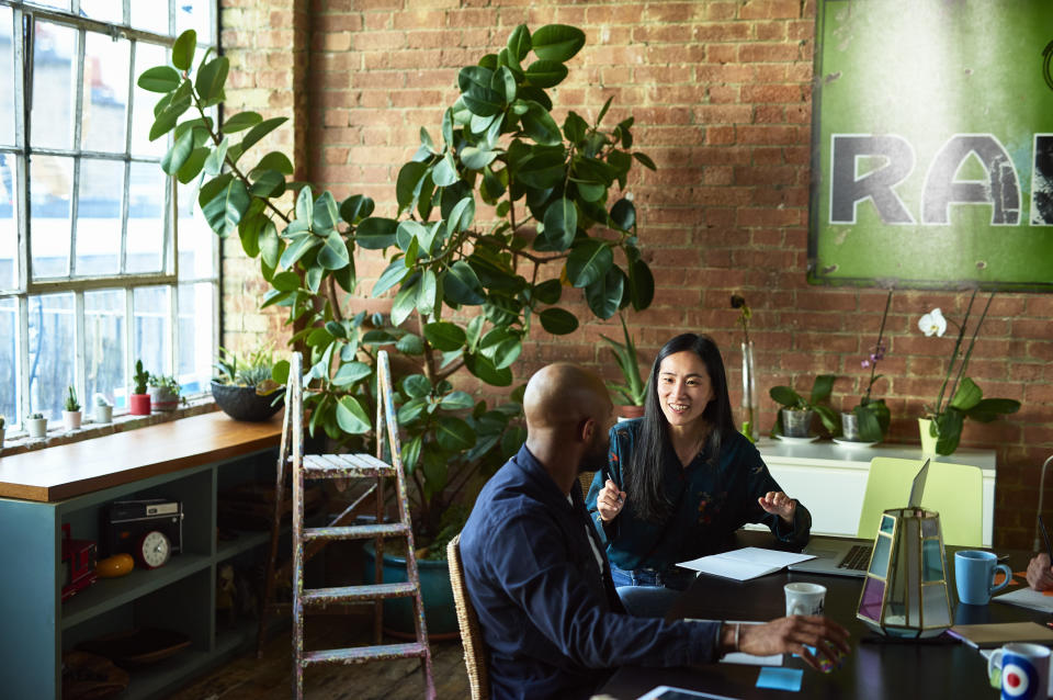 An office is definitely more inviting with plants. But a study from the Journal of Experimental Psychology also found that they help employees concentrate. (Photo: 10'000 Hours via Getty Images)