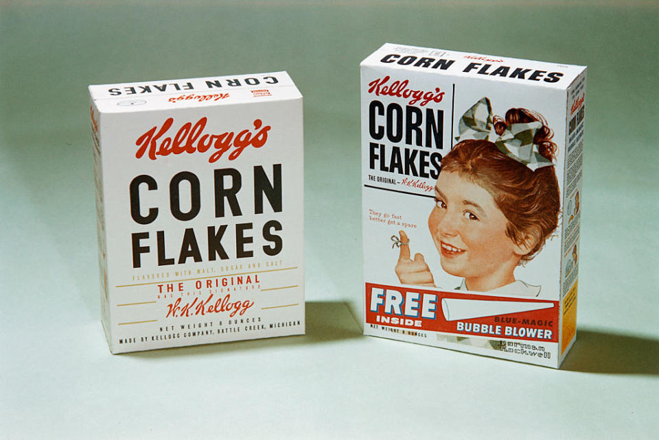 Two vintage Kellogg's Corn Flakes cereal boxes, one advertising a free bubble blower inside