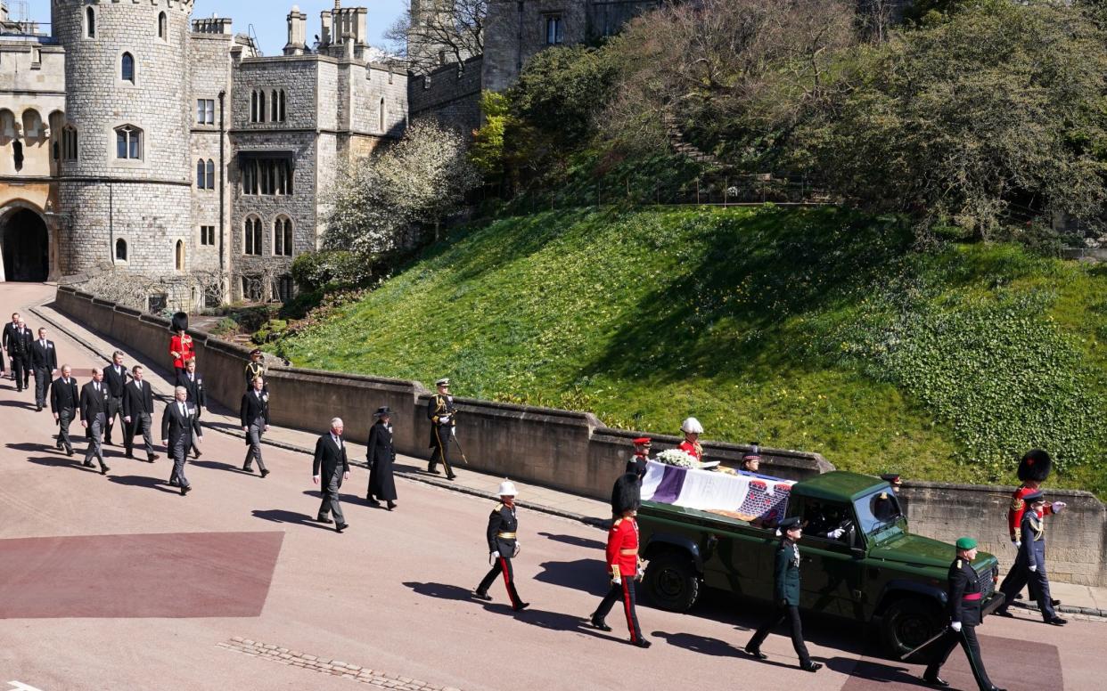 WINDSOR, ENGLAND - APRIL 17: The Royal Family walk behind Prince Philip, Duke of Edinburgh's coffin, carried by a Land rover hearse, in a procession during the funeral of Prince Philip, Duke of Edinburgh at Windsor Castle on April 17, 2021 in Windsor, United Kingdom. Prince Philip of Greece and Denmark was born 10 June 1921, in Greece. He served in the British Royal Navy and fought in WWII. He married the then Princess Elizabeth on 20 November 1947 and was created Duke of Edinburgh, Earl of Merioneth, and Baron Greenwich by King VI. He served as Prince Consort to Queen Elizabeth II until his death on April 9 2021, months short of his 100th birthday. His funeral takes place today at Windsor Castle with only 30 guests invited due to Coronavirus pandemic restrictions. (Photo by Paul Edwards-WPA Pool/Getty Images) - Paul Edwards/WPA Pool/Getty Images