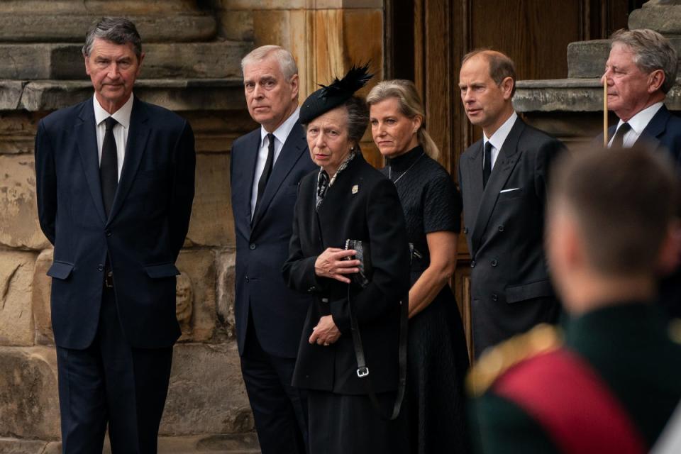 From left, Vice Admiral Timothy Laurence, the Duke of York, the Princess Royal, the Countess of Wessex, and the Earl of Wessex watch as the coffin of the Queen, draped with the Royal Standard of Scotland, completes its journey from Balmoral to the Palace of Holyroodhouse (Aaron Chown/PA Wire)