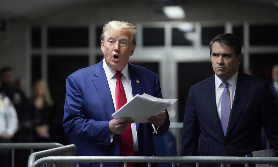 Former President Donald Trump, with attorney Todd Blanche, right, arrives at Manhattan criminal court in New York, on Friday, May 10, 2024. (Timothy A. Clary/Pool Photo via AP)