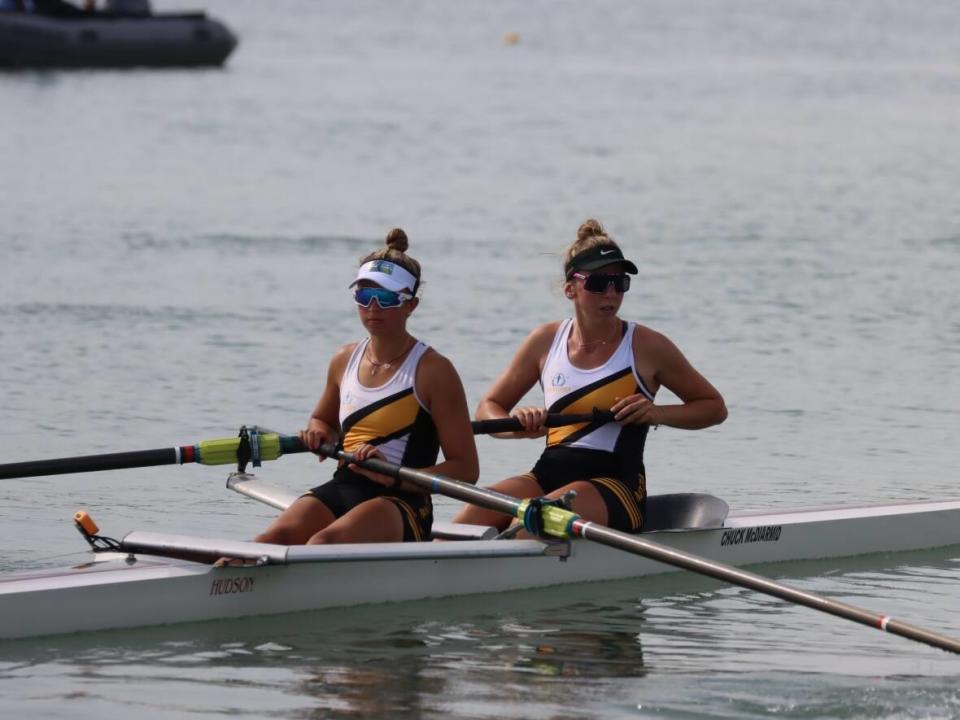 Manitoba's Katie Sierhuis, right, and Leah Miller are shown at the Canada Games in Niagara, Ont., in this Wednesday handout photo. Sierhuis was a promising hockey and soccer player before she diagnosed with a rare form of cancer when she was 12. She tried rowing as a fresh start after her recovery. (Dan Labricciosa/Handout/The Canadian Press - image credit)