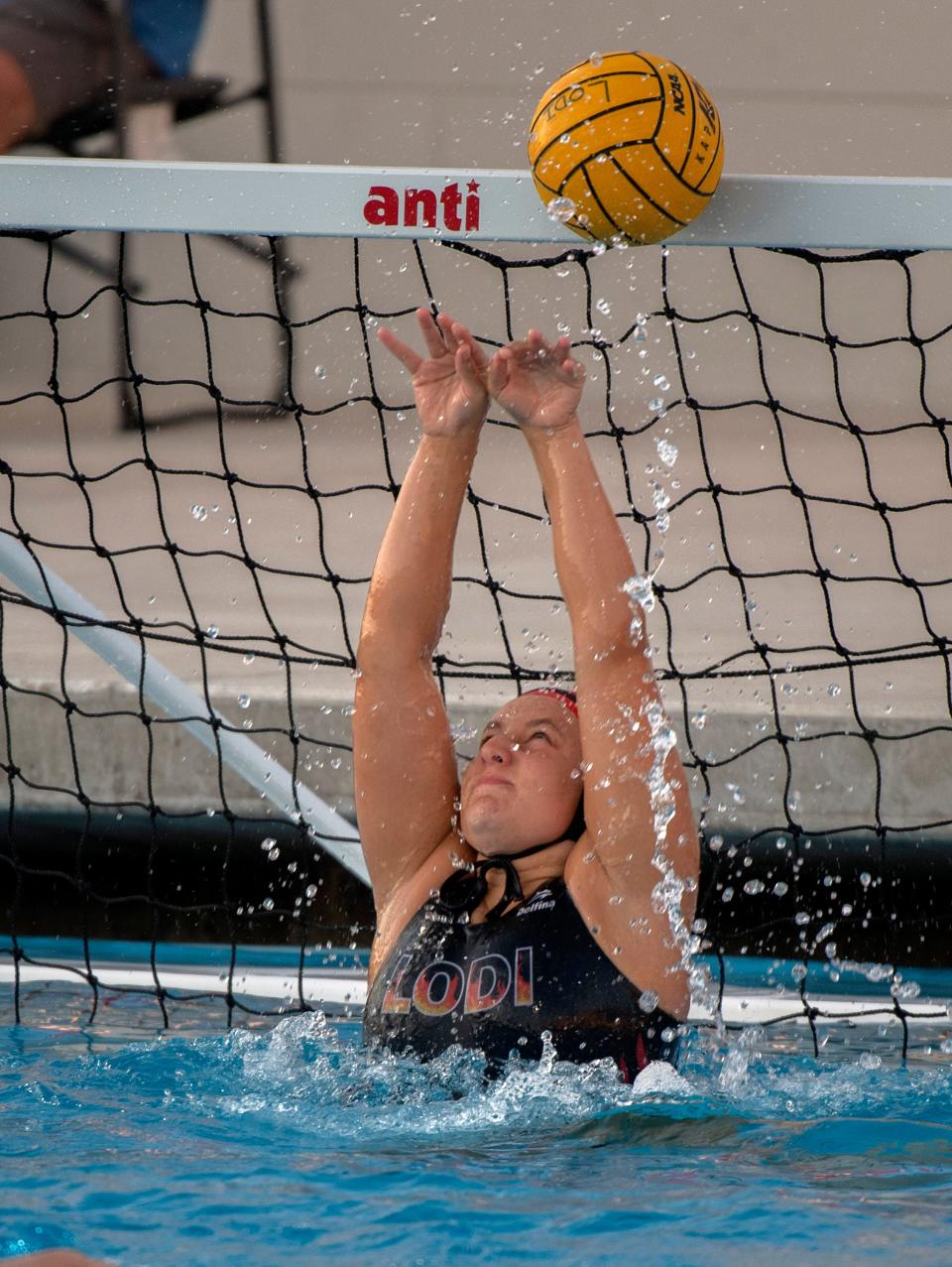 Lodi's Kylie Richardson blocks a shot during girls waterpolo playoff game against Edison at Lodi on Oct. 21, 2023.