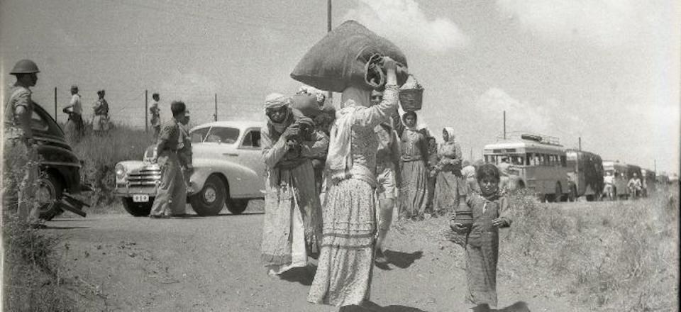 Palestinian women leave the village of Tantura after its capture by Israeli forces in 1948. (Israel State Archives, The National Library of Israel)