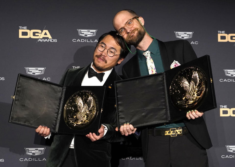 Daniel Kwan, left, and Daniel Scheinert pose in the press room with the award for outstanding directorial achievement in a theatrical feature film for "Everything Everywhere All at Once" at the 75th annual Directors Guild of America Awards on Saturday, Feb. 18, 2023, at the Beverly Hilton hotel in Beverly Hills, Calif. (AP Photo/Chris Pizzello)