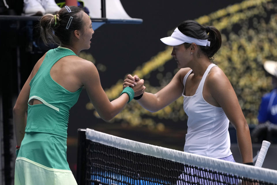 Zheng Qinwen, left, of China is congratulated by compatriot Wang Yafan following their third round match at the Australian Open tennis championships at Melbourne Park, Melbourne, Australia, Saturday, Jan. 20, 2024. (AP Photo/Andy Wong)