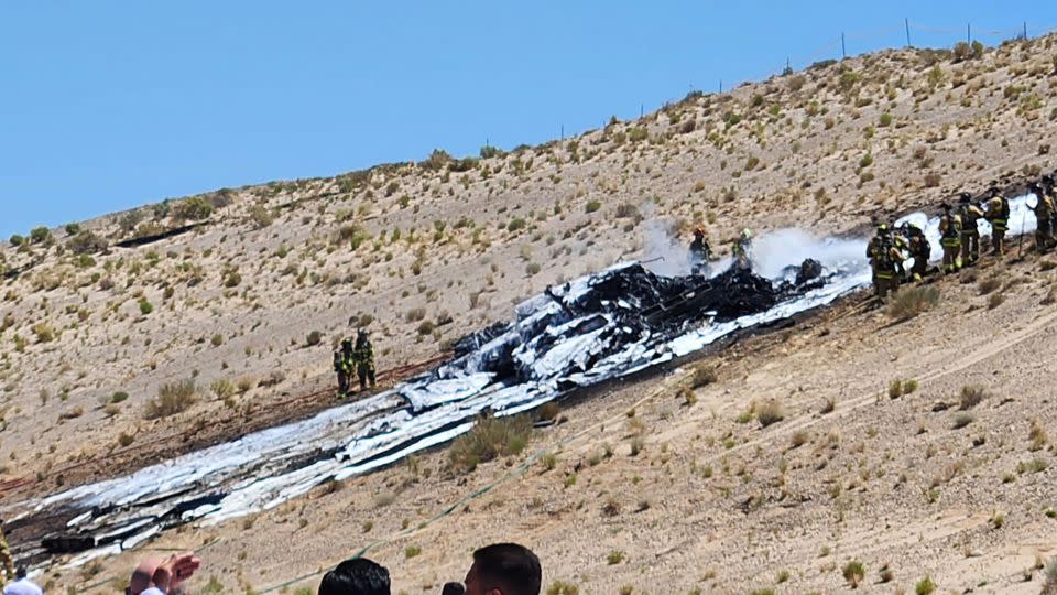 Firefighters extinguished a fire at the crash site. - Bernalillo County Fire Rescue