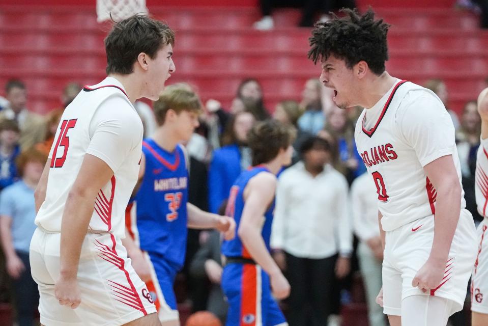 Center Grove Trojans guard Jalen Bundy (0) yells with Center Grove Trojans Joey Schmitz (15) on Saturday, Jan. 13, 2024, during the Johnson County finals at Center Grove High School in Greenwood. The Center Grove Trojans defeated Whiteland, 68-43.