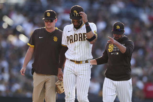 Ha-Seong Kim of the San Diego Padres points towards the dugout