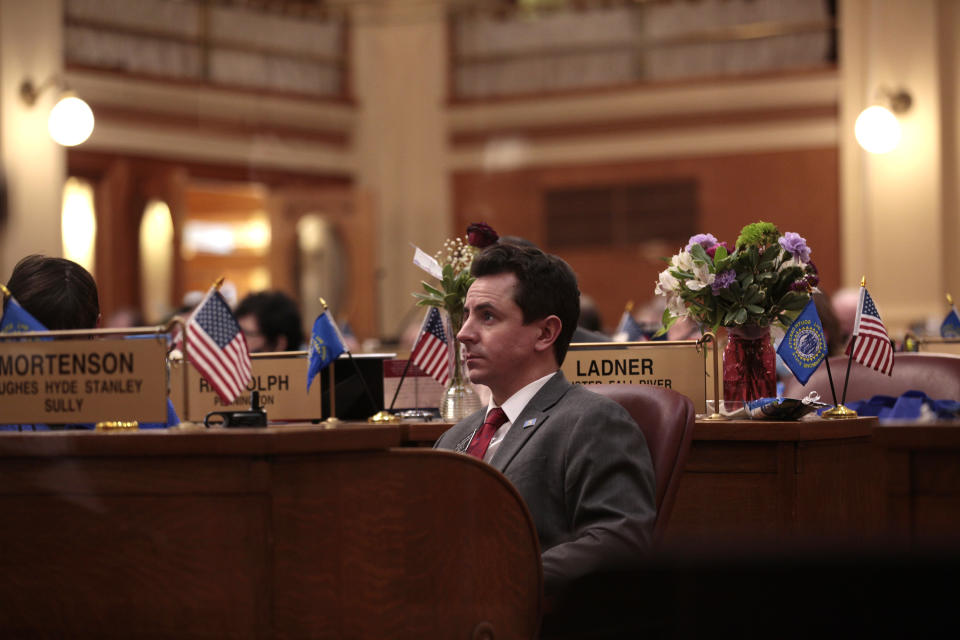 Republican Rep. Will Mortensen listens to debate in the South Dakota House on Tuesday, Feb. 23, 2021, in South Dakota/Capital in Pierre, S.D., after he sponsored a resolution to impeach Attorney General Jason Ravnsborg. The state's top law enforcement officer is facing misdemeanor charges for striking and killing a man with his car. (AP Photo/Stephen Groves)