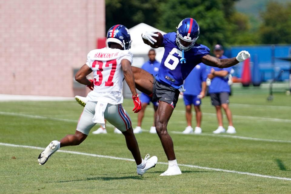 New York Giants rookie wide receiver Bryce Ford-Wheaton (6) makes a catch over rookie cornerback Tre Hawkins III on the first day of training camp in East Rutherford on Wednesday, July 26, 2023.