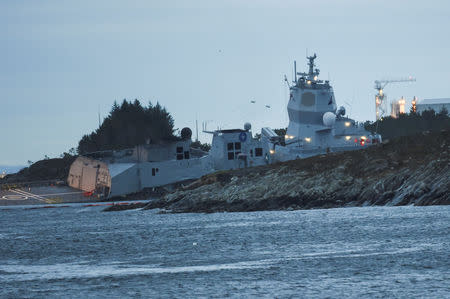 The Norwegian frigate "KNM Helge Ingstad" takes on water after a collision with the tanker "Sola TS" in Oygarden, Norway, November 8, 2018. NTB Scanpix/Marit Hommedal via REUTERS