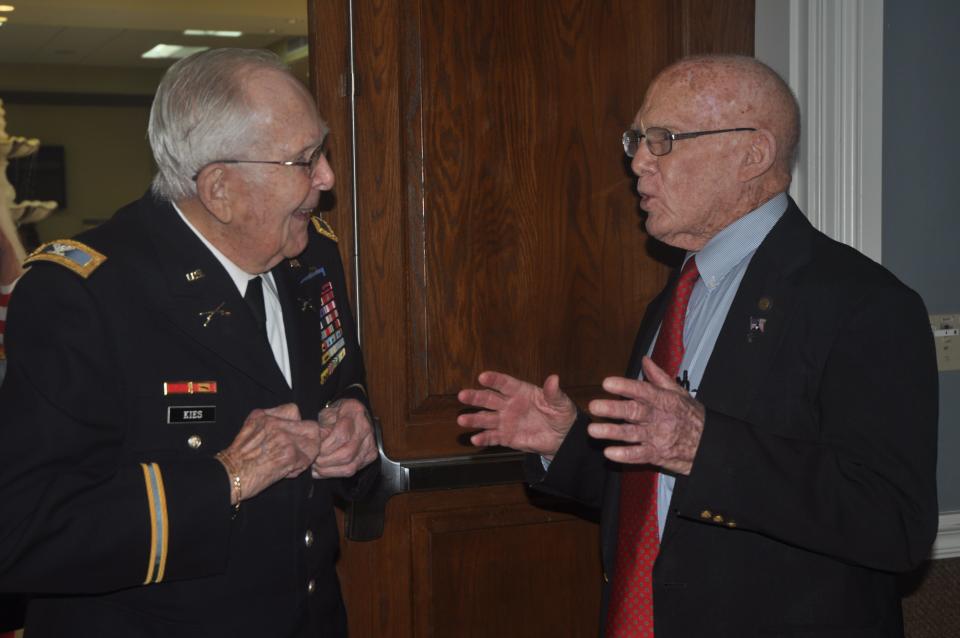 Retired U.S. Army Col. Robert Kies, 97, meets retired Maj. Gen. James Dozier, 90, at a ceremony commemorating the 80th anniversary of the attack on Pearl Harbor. The event took place on Tuesday, Dec. 7, 2021, at New Hope Ministries in Naples. (Photo by Andrea Stetson)