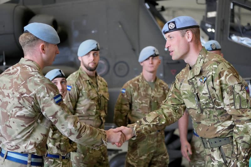 Britain's Prince William, Prince of Wales, speaks to military personnel at the Army Aviation Centre in Middle Wallop