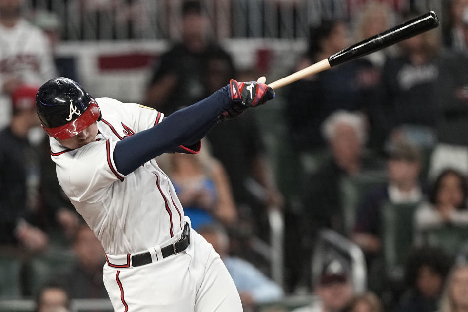 Atlanta Braves third baseman Austin Riley (27) hits a single against the Philadelphia Phillies during the eighth inning of Game 1 of a baseball NL Division Series, Saturday, Oct. 7, 2023, in Atlanta. (AP Photo/Brynn Anderson)