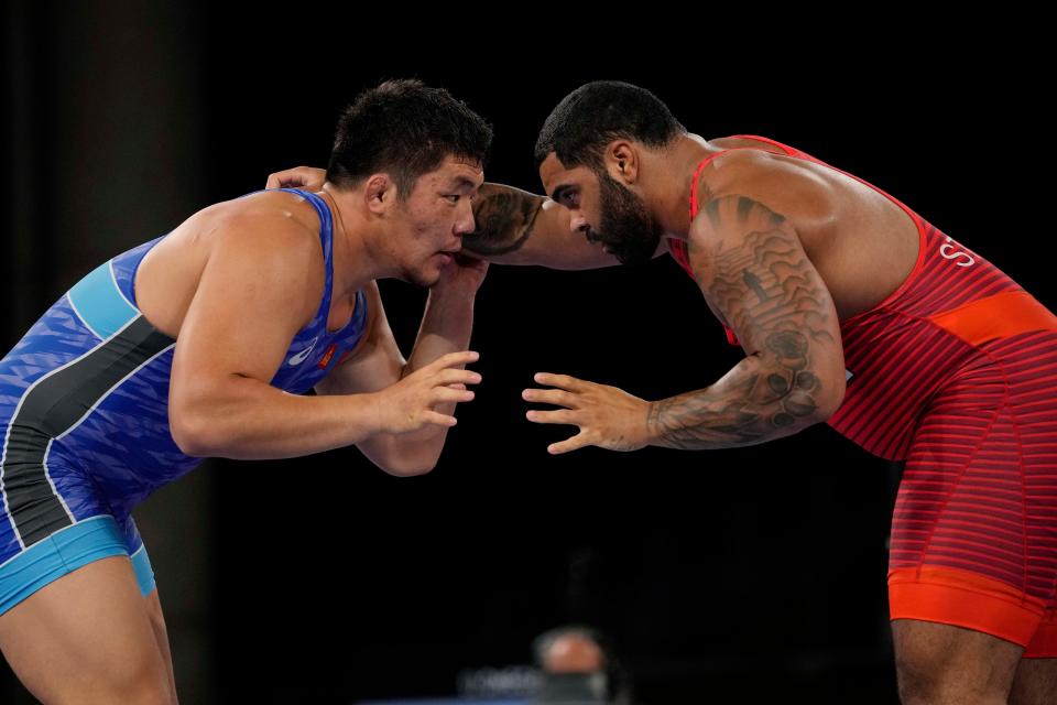 United State's Gable Dan Steveson compete with Mongolia's Lkhagvagerel Munkhtur during the men's 125kg Freestyle wrestling semifinal match at the 2020 Summer Olympics