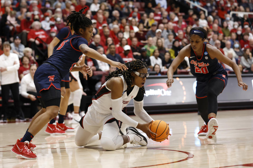 Mississippi guard Angel Baker (15) and guard Ayanna Thompson (20) defend Stanford forward Francesca Belibi (5) during the second half of a second-round college basketball game in the women's NCAA Tournament, Sunday, March 19, 2023, in Stanford, Calif. (AP Photo/Josie Lepe)