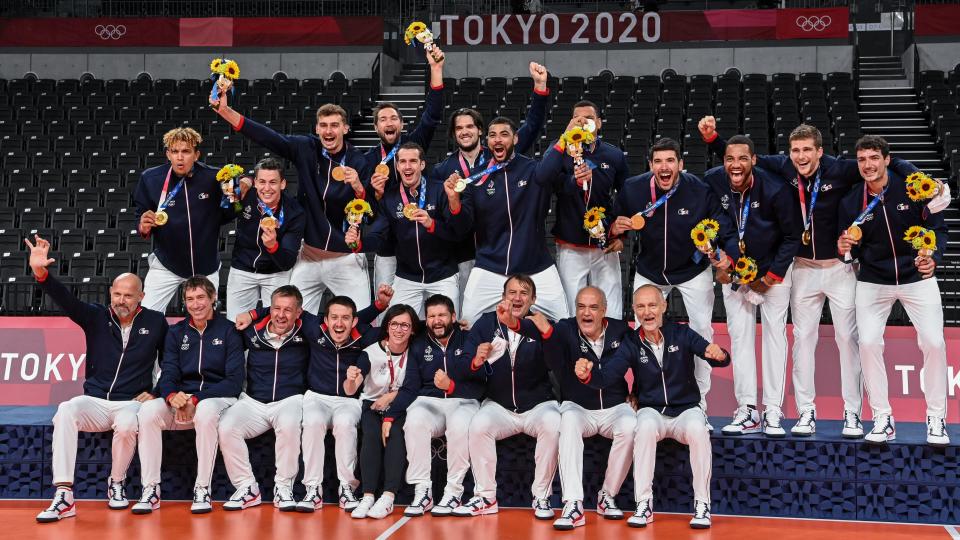 The French volleyball team are celebrating their gold medal 