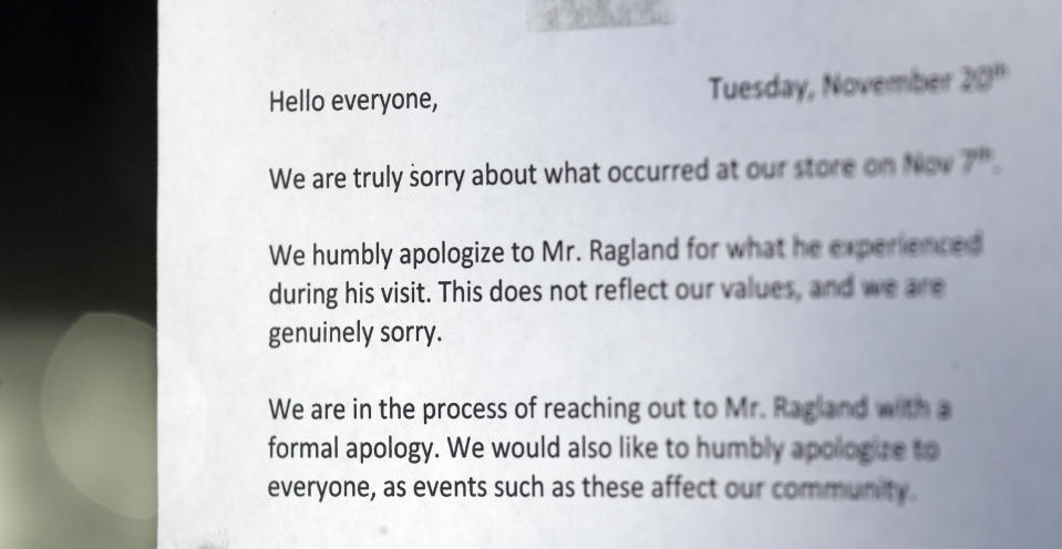 A note of apology is attached to the door of a closed frozen-yogurt shop Tuesday, Nov. 20, 2018, in Kirkland, Wash. The police department there has apologized for an incident in which officers helped the owner of the Menchie's shop expel Byron Ragland, an African-American man, from the business because employees said they felt uncomfortable. The Seattle Times reported that the shop's owner called police on Nov. 7 about Ragland, who works as a court-appointed special advocate, who was in the shop supervising a court-sanctioned outing between a mother and her son. (AP Photo/Elaine Thompson)