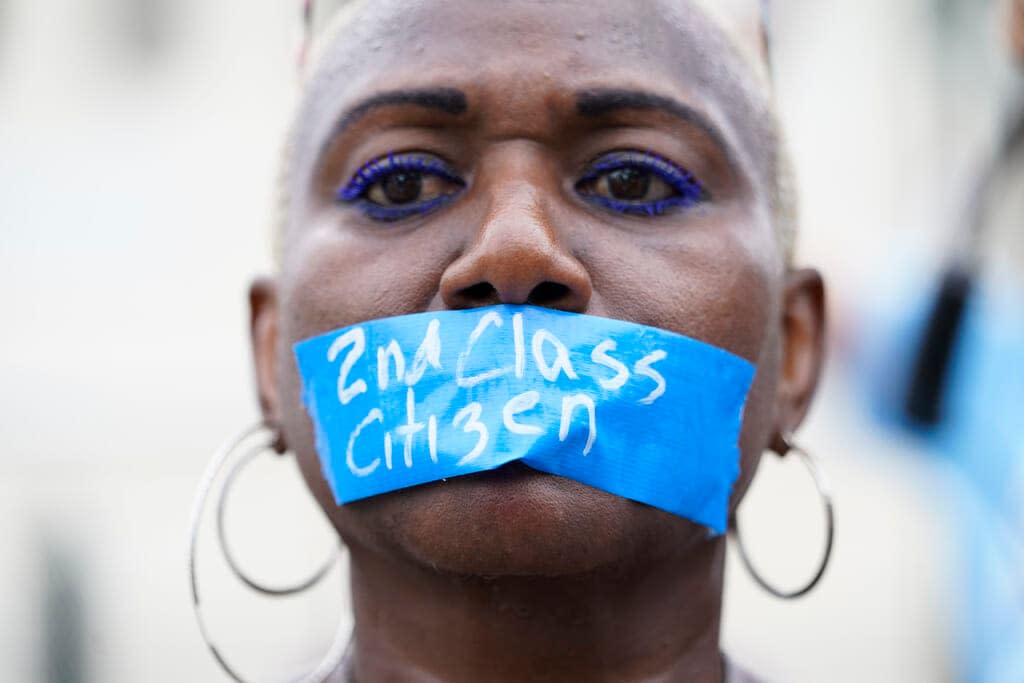 An abortion-rights activist wears tape reading “2nd Class Citizen” on their mouth as they protest outside the Supreme Court in Washington, Friday, June 24, 2022. The Supreme Court has ended constitutional protections for abortion that had been in place nearly 50 years in a decision by its conservative majority to overturn Roe v. Wade. (AP Photo/Jacquelyn Martin)