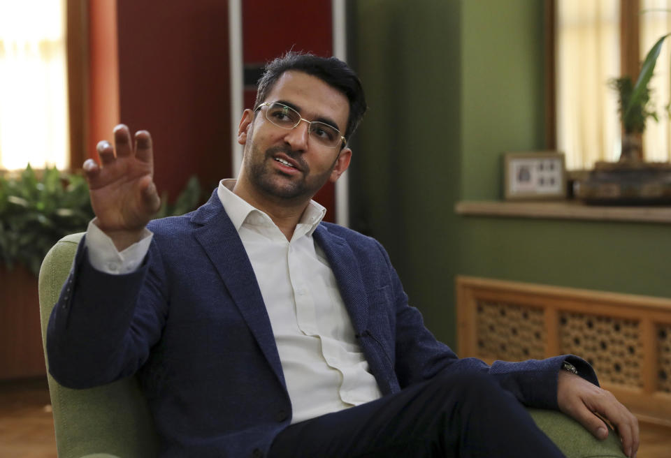 FILE - In this Sunday, July 7, 2019 photo, Iran's telecommunications Minister Mohammad Javad Azari Jahromi is interviewed by The Associated Press at his office in Tehran, Iran. The U.S. Treasury on Friday, Nov. 22, 2019, sanctioned Jahromi over a dayslong internet shutdown in Iran by authorities amid protests and unrest that followed government-set gasoline prices sharply rising. (AP Photo/Vahid Salemi, File)