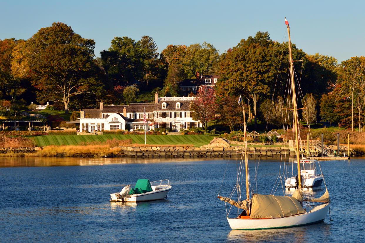 Greenwich, CT, USA October 27, 2013 Sailboats are moored in Indian Harbor in front of an estate in Greenwich Connecticut