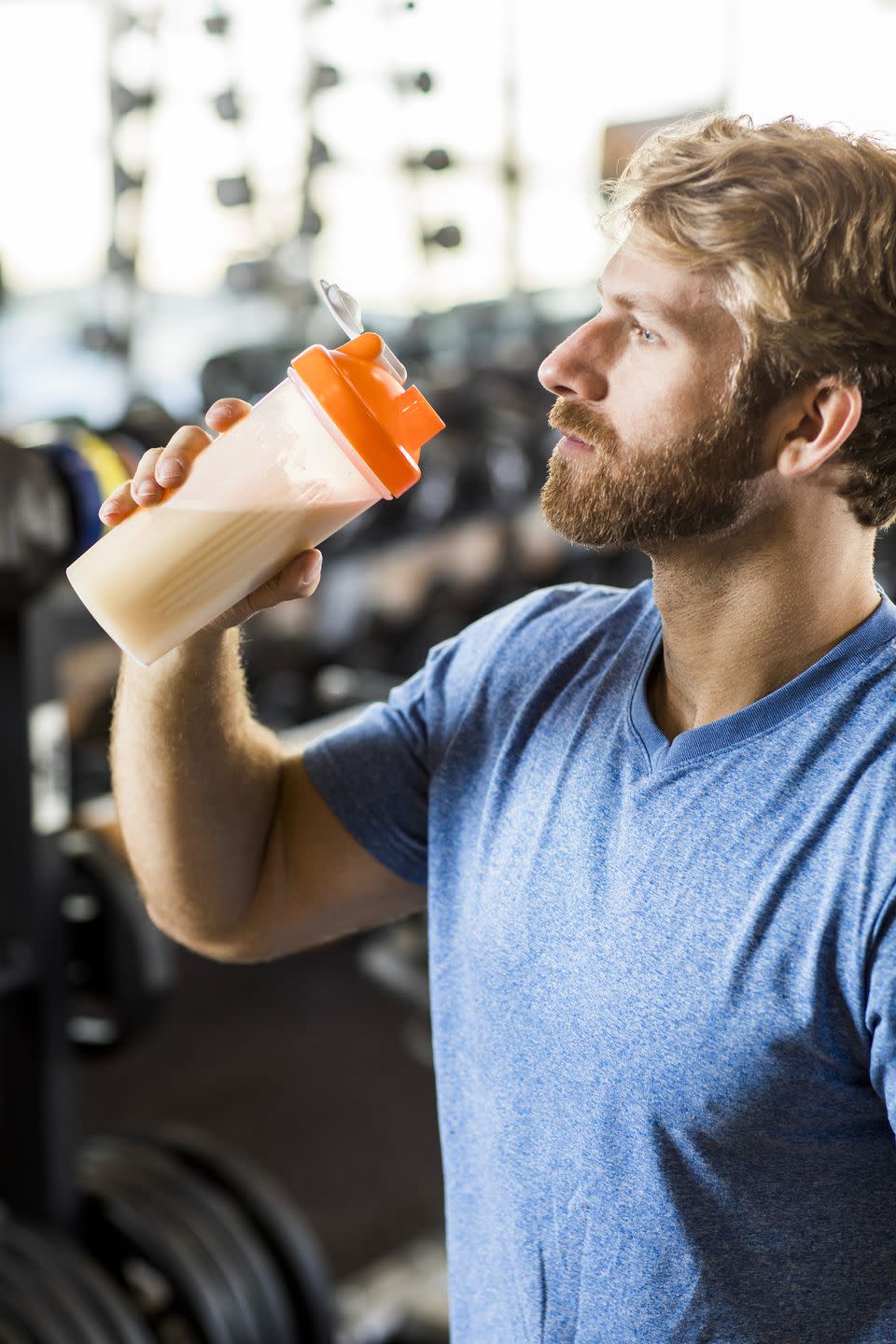 Man drinking protein drink.